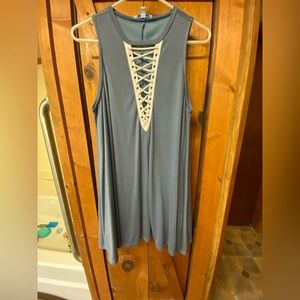 She+sky blue dress with crisscross chest.